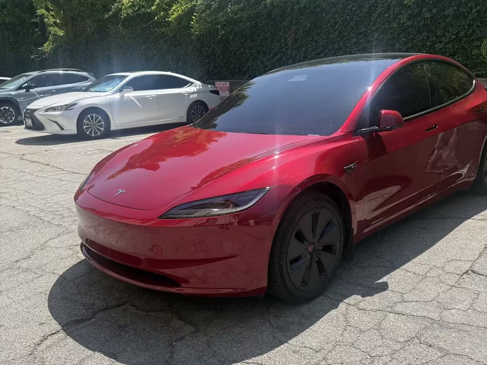 Red Tesla Model 3 after ceramic window tint